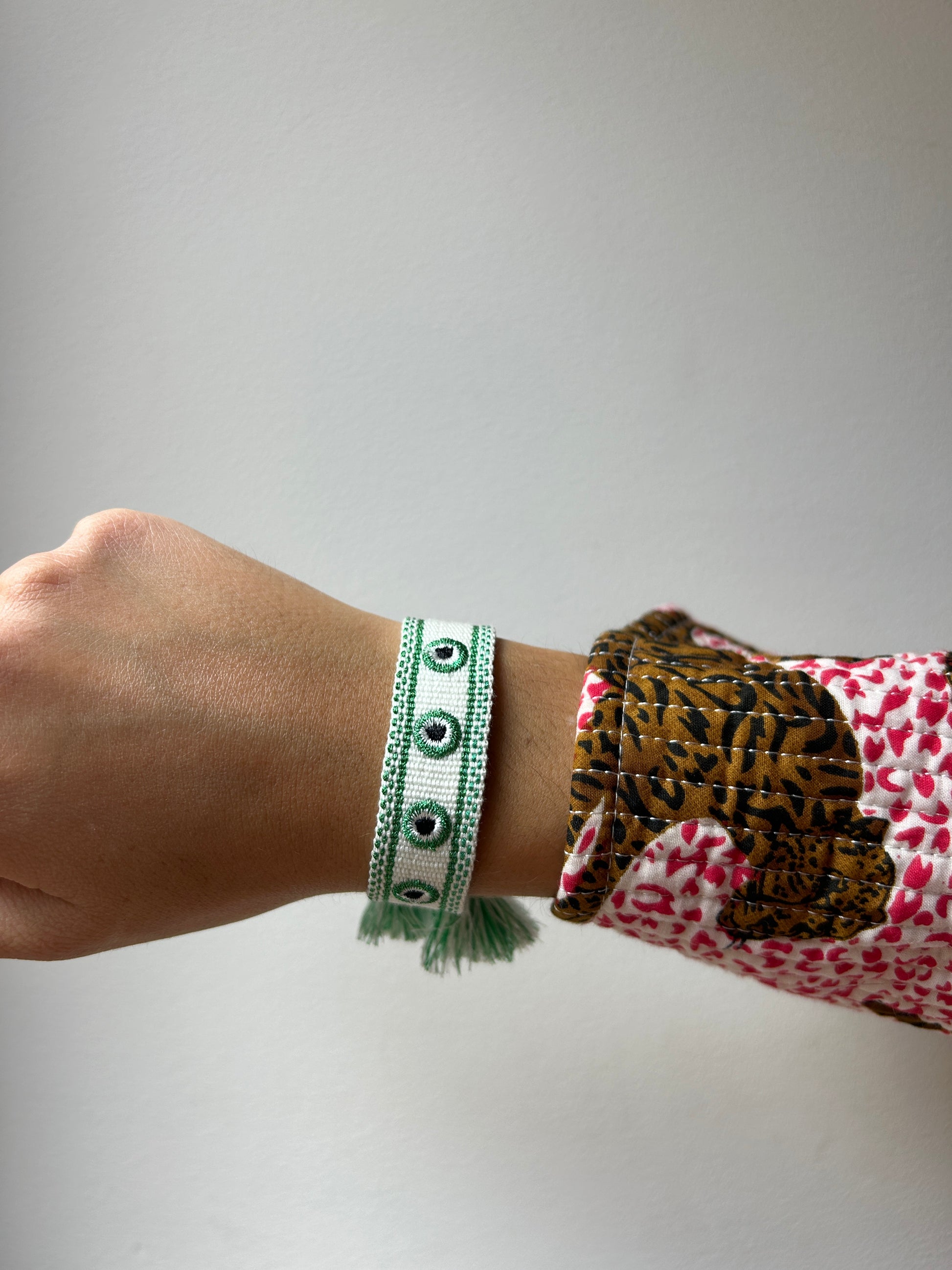 Bracelet femme Tissé Orya Blanc et Oeil Vert